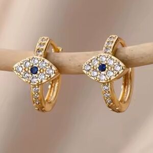 NWOT 18K gold, plated, stainless steel evil eye Huggies earrings